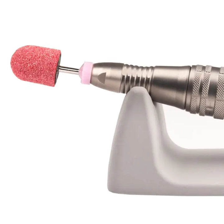 Elektrischer Nagelfräser mit pinker Schleifscheibe für professionelles Nagelstudio