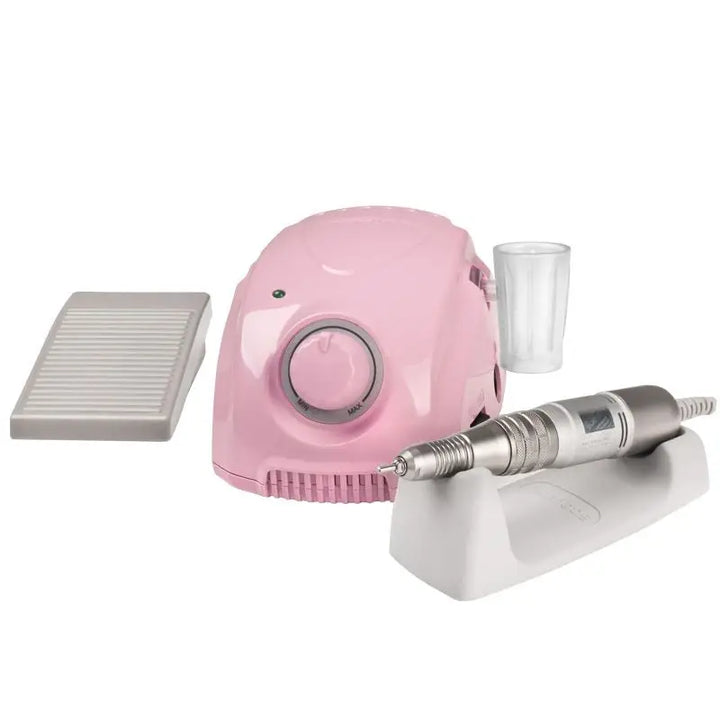 Pink elektrischer Nagelbohrset Fräser Marathon 3 Champion Pink auf einem Tisch