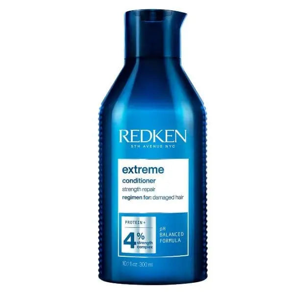 Blaue Redken Extreme Conditioner Flasche vor Produkt Redken Extreme Conditioner