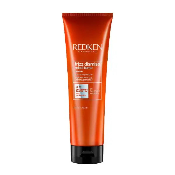 Orange Tube Redken Frizz Dismiss Rebel Tame Creme auf Produktverpackung